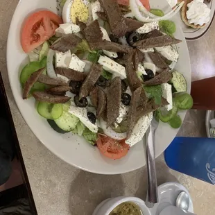 Greek salad with gyro meat. Fresh feta and lots of veggies. Dressing was on the side.