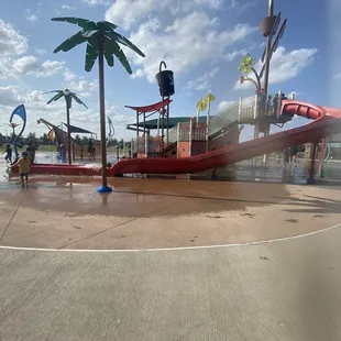 Splash pad and big slide (there's another slide on the other side for smaller kiddos)