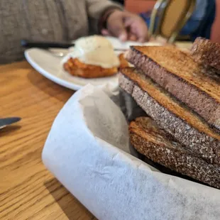 a basket of toast and eggs