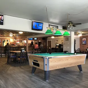a pool table and televisions