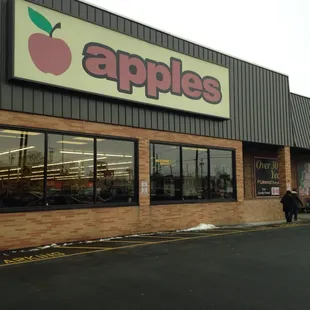 a storefront with a car parked in front of it