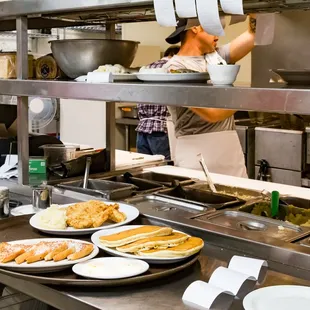 a chef preparing food in the kitchen