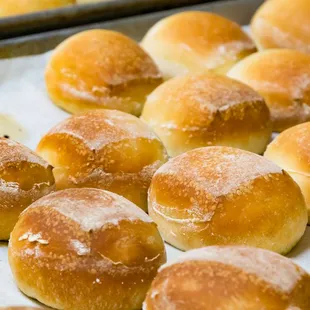 a tray of freshly baked doughnuts