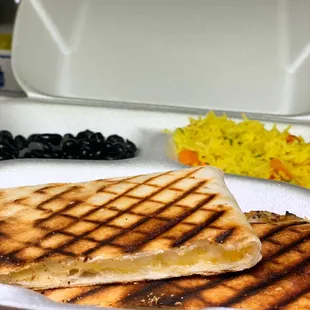 Grilled cheese quesadilla with beans and turmeric rice