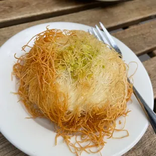 a plate of food on a wooden table