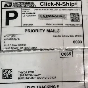 a close up of a priority mail