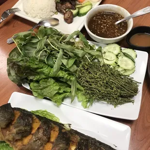 Sadao with fried catfish and fried pork with rice.