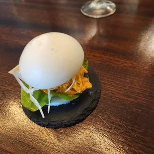 Bun made of tomato water, creative.  Light and fluffy paired so well with the saucy crab in it. This was amazing