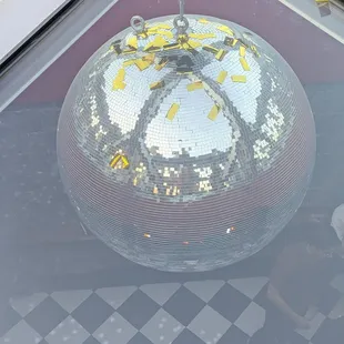 Disco ball from the roof looking through the glass ceiling.
