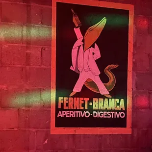 a poster of a man in a white suit with a lizard on his head
