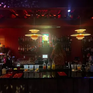 a bar with a lot of bottles of alcohol