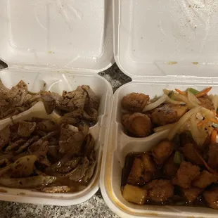 two takeout containers with food in them