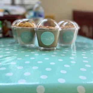 One of each panna cotta in their display case