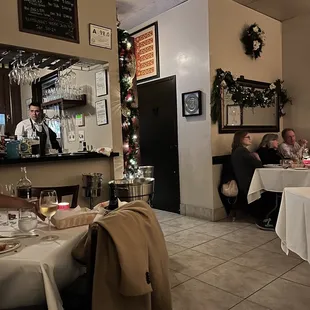 a restaurant with people sitting at tables