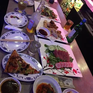 a long table with plates of food on it