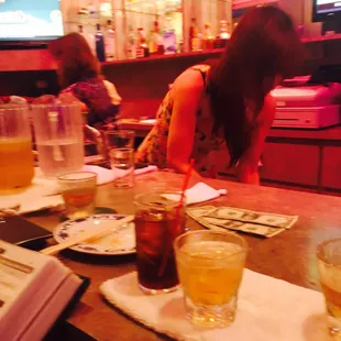 a woman sitting at a bar