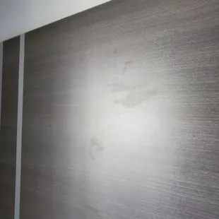 Greasy handprints on the headboard.. atleast someone enjoyed their stay I guess.