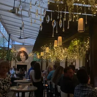 a group of people sitting in a restaurant