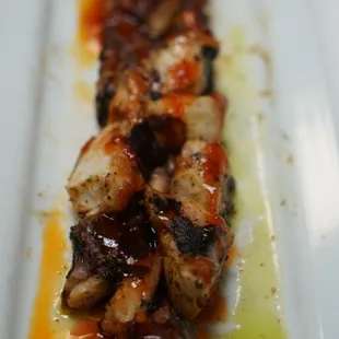 a plate of food with meat and sauce