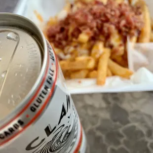 a can of soda and fries