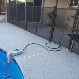 Autofill they "installed" a 2nd time while we were on vacation. Note how pool level is so low, it's under the device. Hose never attached!