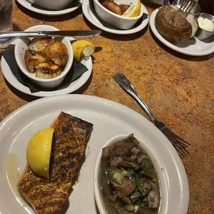 Blackened salmon, burgundy mushrooms, roasted vegetables, scallops, baked potato. We ordered a bit of everything we like this trip.