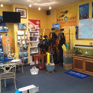 Waiting area with fish tank and toys.
