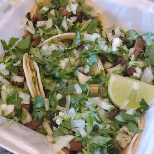 Asada tacos are to die for with that handmade tortilla