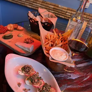 Happy hour deviled eggs, fries, charcuterie/cheese board and a lovely glass of their happy hour red