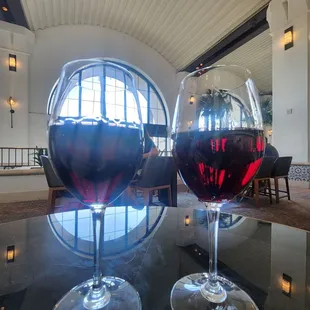 two glasses of wine on a table