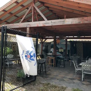 a patio with tables and chairs