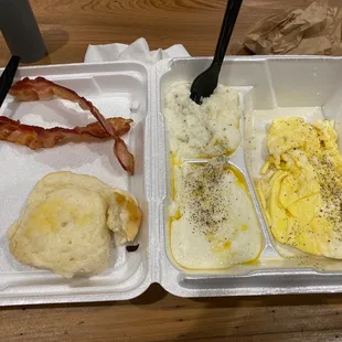 Two egg breakfast with bacon, grits, and biscuit. (Are some already) always hot, fast, and delicious!