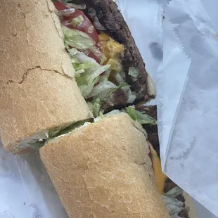 a large sandwich with meat and lettuce