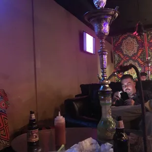 a man smoking a hookah