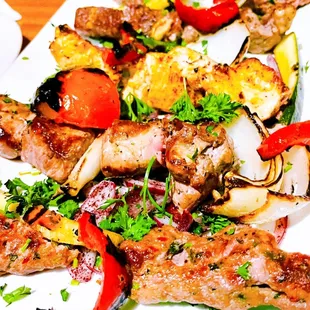 a plate of grilled meat and vegetables