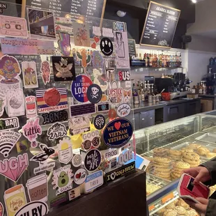 a woman standing in front of the counter