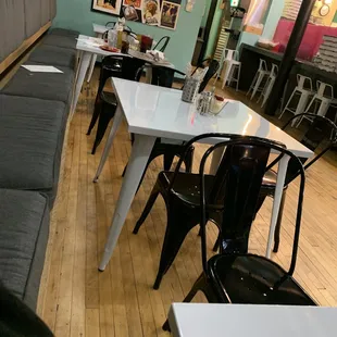 4 tables in the back (one large table up front, the rest of the seating is tall metal bar stools)