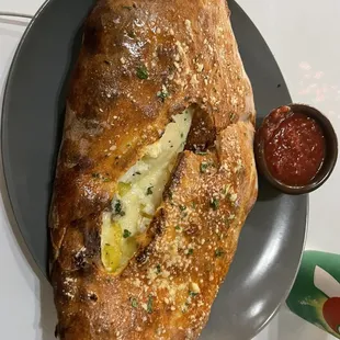 Baked 3 Cheese Calzone with mushrooms and banana peppers