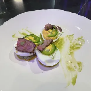 Deviled eggs over the top amazing.  Chimichurri, avocado puree, yummy.