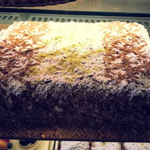 a chocolate cake in a display case