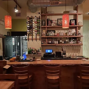 a view of a bar with a laptop on the counter