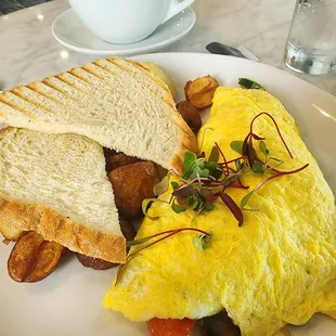 Vegetarian Omelet, House potatoes, and toast.