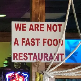 a sign that says we are not a fast food restaurant