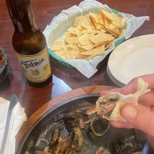 a person holding a tortilla