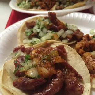 Tripas and Al pastor tacos.