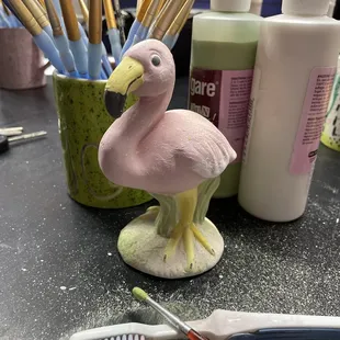 Before photo of pottery painted by a customer. When we glaze and fire it, it becomes shiny and bright!