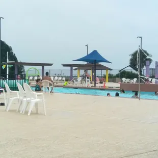 There are easy access stairs exiting the slide area, but you enter the pool from there.