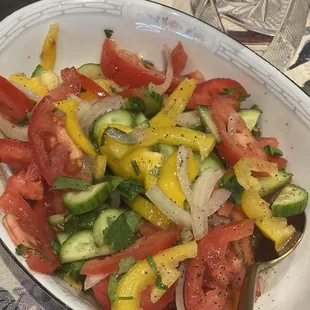 Tomato cucumber pepper salad in olive oil and red wine vinegar