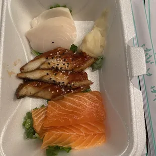 Salmon, eel and white tuna sashimi. Paper thin slices.