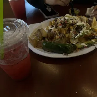 Carne Asada Fries* y agua de fresa